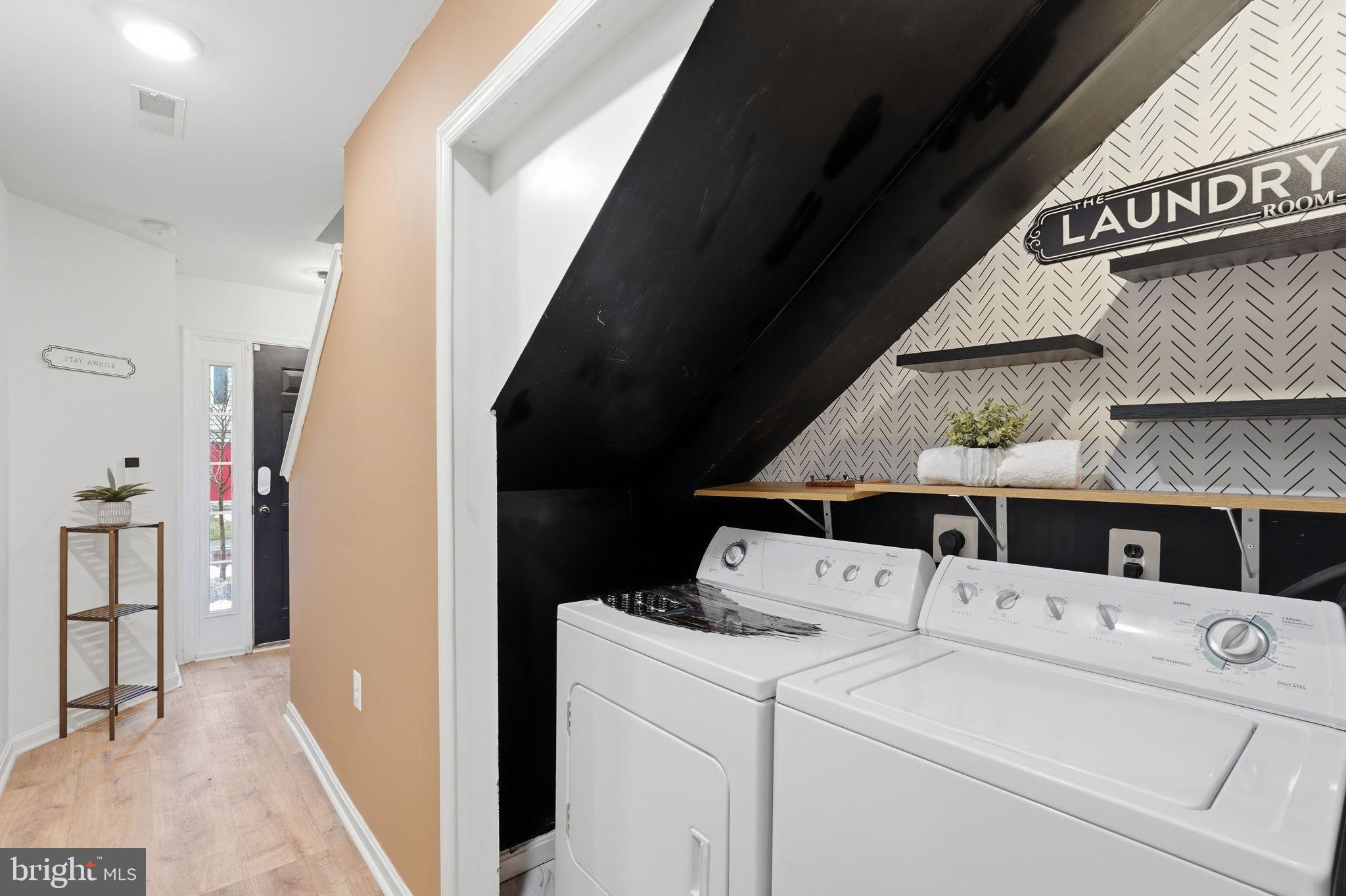 22987 Fontwell Square Sterling, VA 20166 - Photo 17 of 23 Charming laundry nook under the stairs.