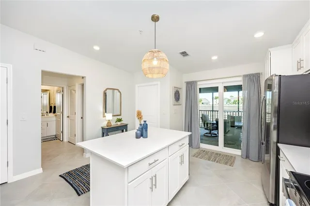 a living room with furniture a flat screen tv and a large window