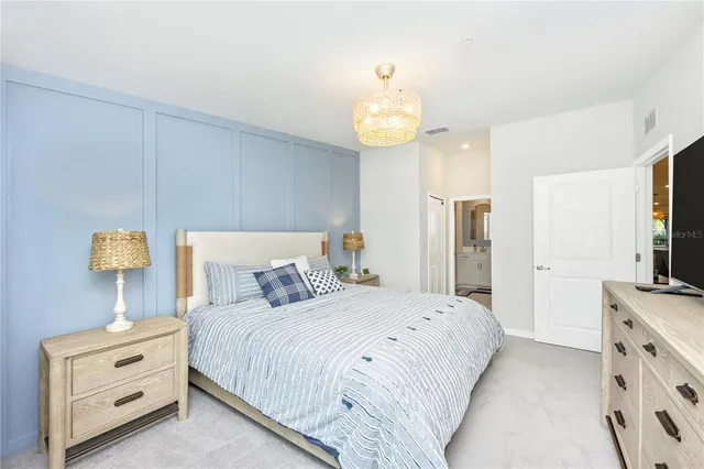 a view of a livingroom with workspace and a couch