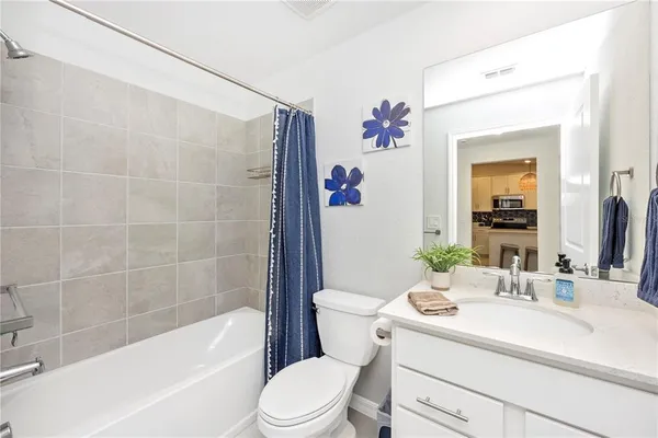 a view of a room with gym equipment and a large window