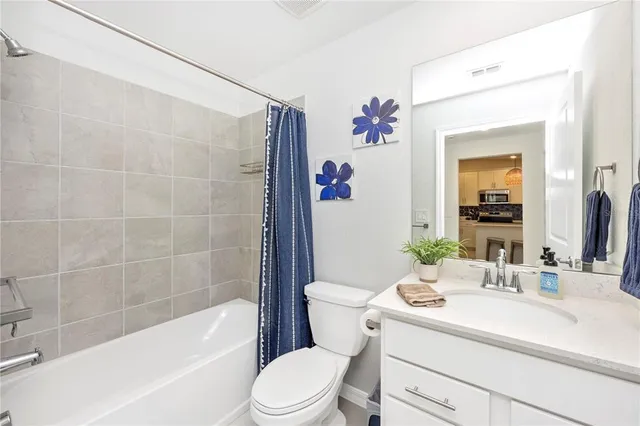 a view of a room with gym equipment and a large window