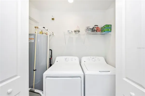 a swimming pool view with a seating space and a garden view