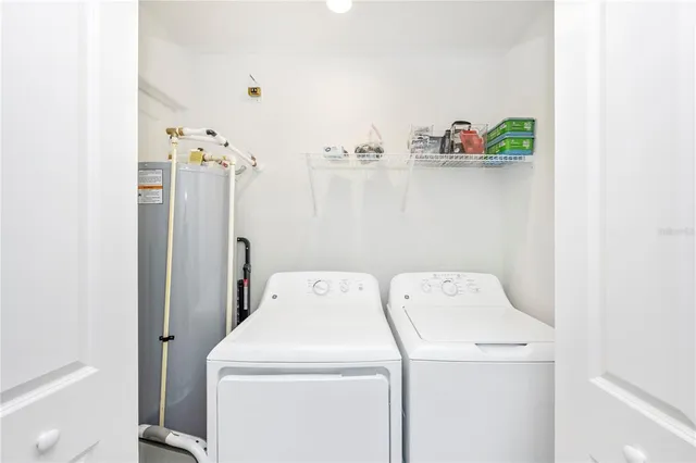 a swimming pool view with a seating space and a garden view
