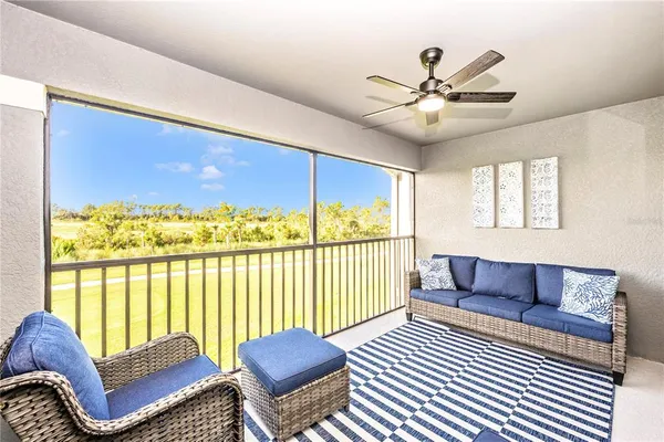 a living room with lots of furniture and a chandelier