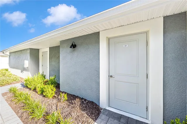 a view of a golf course with an ocean