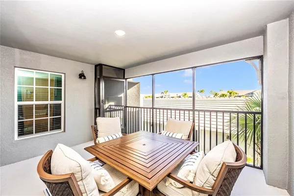 a kitchen with a refrigerator a sink dishwasher a oven and a dining table with wooden floor