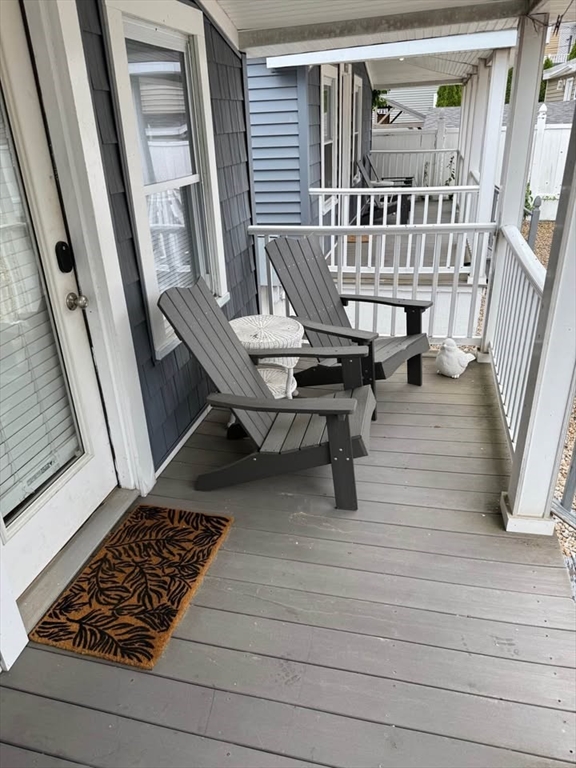 7 Dover Avenue, Unit 2 Hampton, NH 03842 - Photo 2 of 8 a living room with furniture and a rug