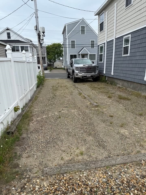 7 Dover Avenue, Unit 2 Hampton, NH 03842 - Photo 8 of 8 a car parked in front of house
