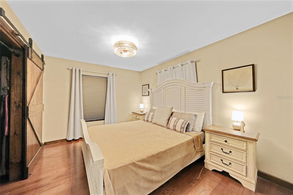 7597 Highway 31 Arcadia, FL 34266 - Photo 11 of 45 a bedroom with a bed and a flat screen tv