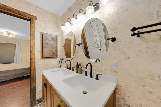 a bathroom with a sink and a mirror
