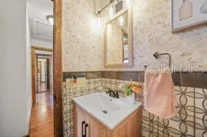 a bathroom with a sink and a mirror