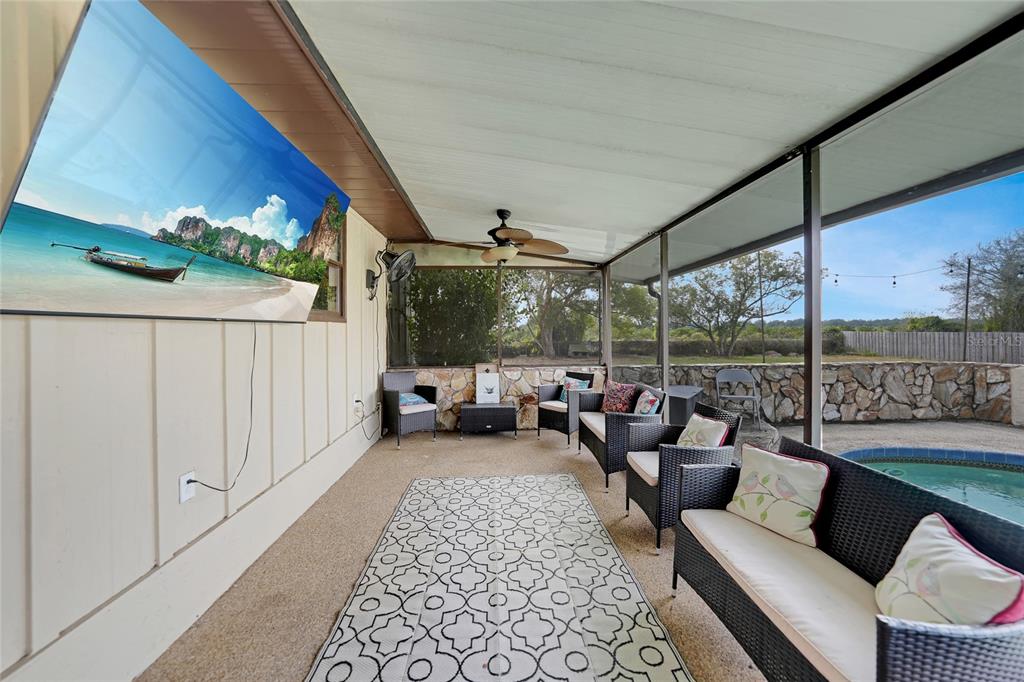 7597 Highway 31 Arcadia, FL 34266 - Photo 23 of 45 a living room with furniture and a floor to ceiling window