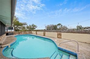 7597 Highway 31 Arcadia, FL 34266 - Photo 26 of 45 a view of a swimming pool with an outdoor seating