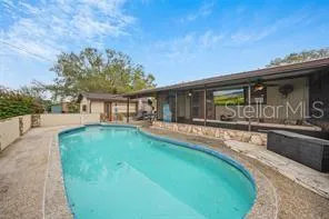 a front view of house with yard and outdoor seating