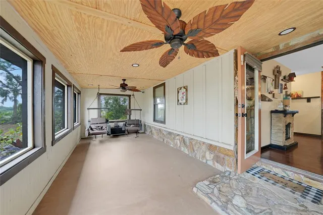 a view of a livingroom with furniture and a ceiling fan