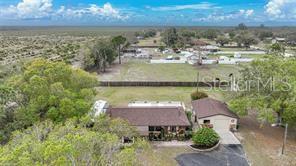 7597 Highway 31 Arcadia, FL 34266 - Photo 36 of 45 an aerial view of a house with a lake view