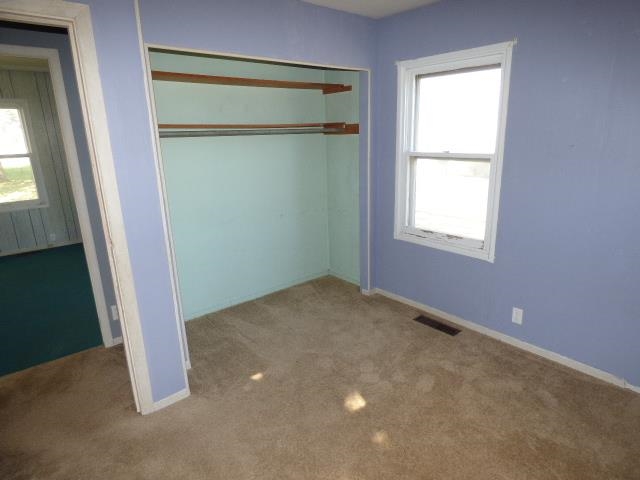 517 Spring Avenue DeKalb, IL 60115 - Photo 8 of 11 an empty room with a window