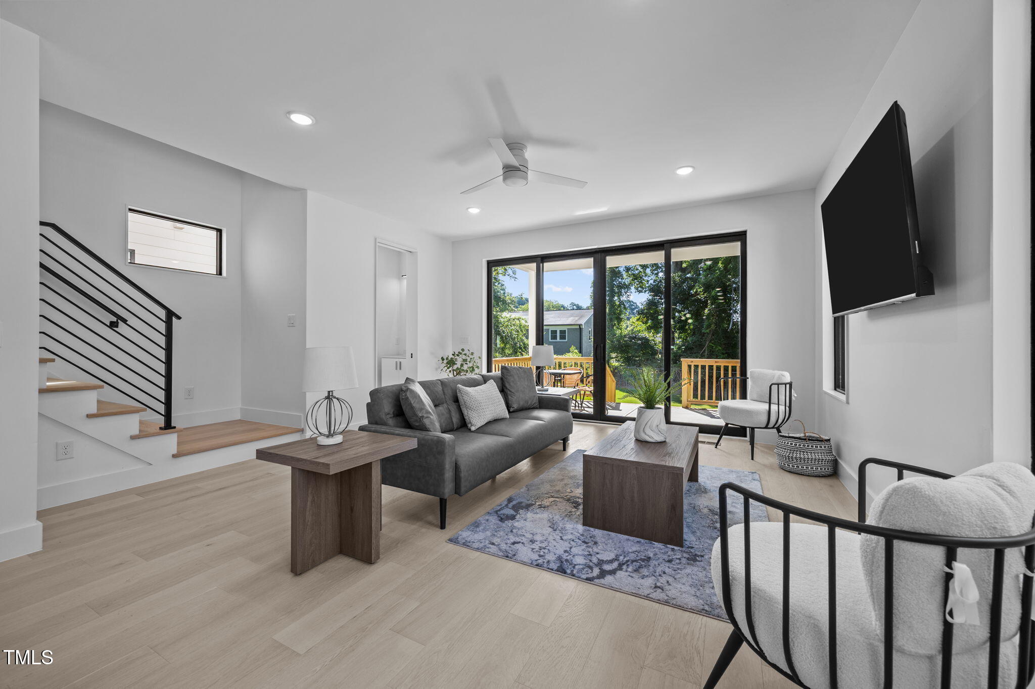 808 Culpepper Lane Raleigh, NC 27610 - Photo 12 of 27 a living room with furniture and a flat screen tv