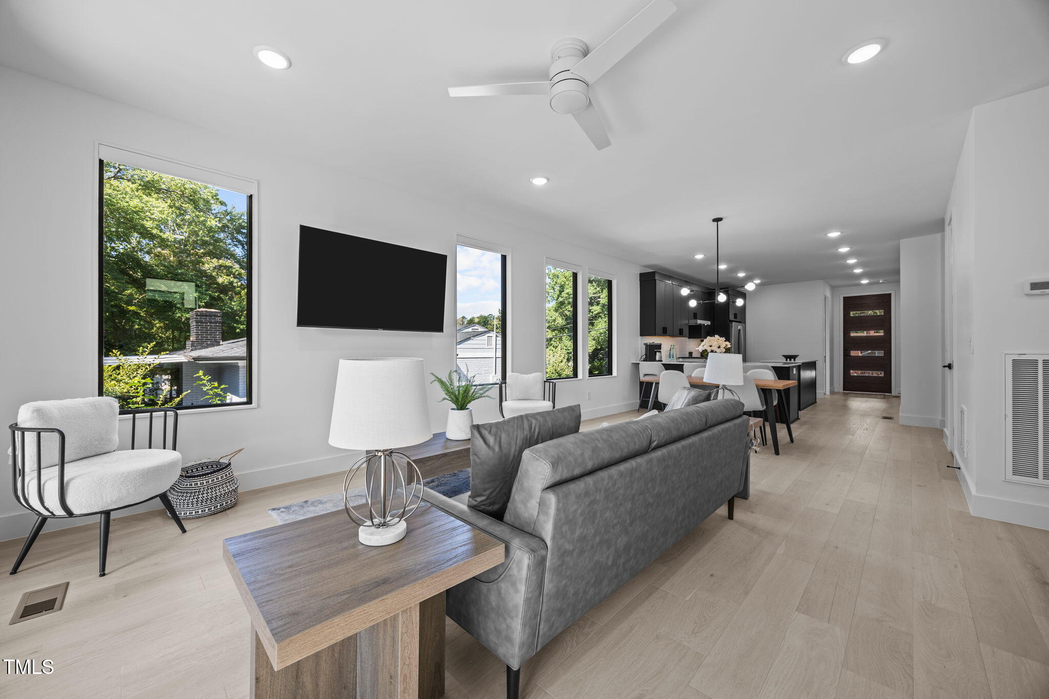 808 Culpepper Lane Raleigh, NC 27610 - Photo 14 of 27 a living room with furniture and a flat screen tv