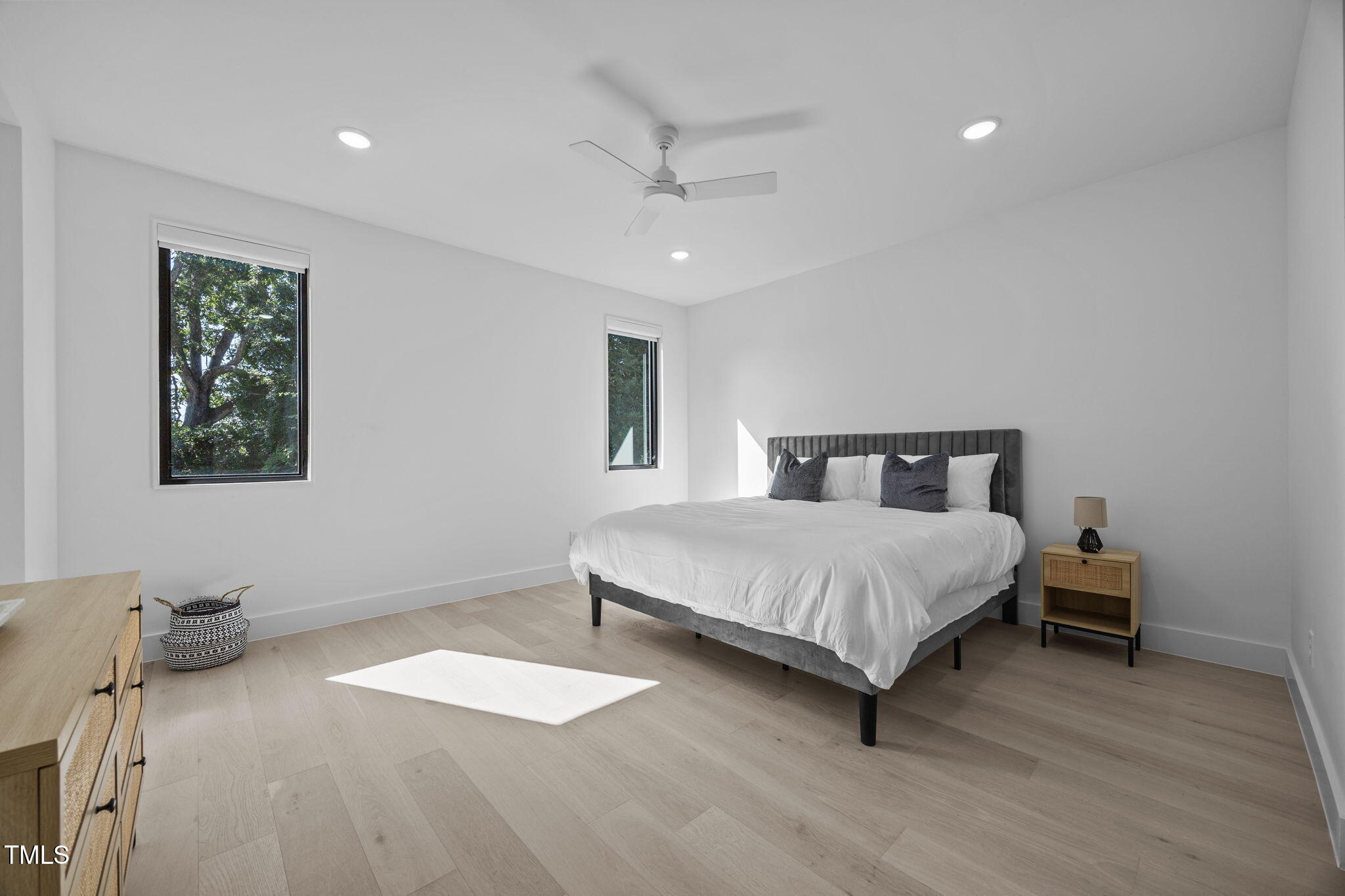 808 Culpepper Lane Raleigh, NC 27610 - Photo 17 of 27 a bedroom with a bed and a painting on the wall