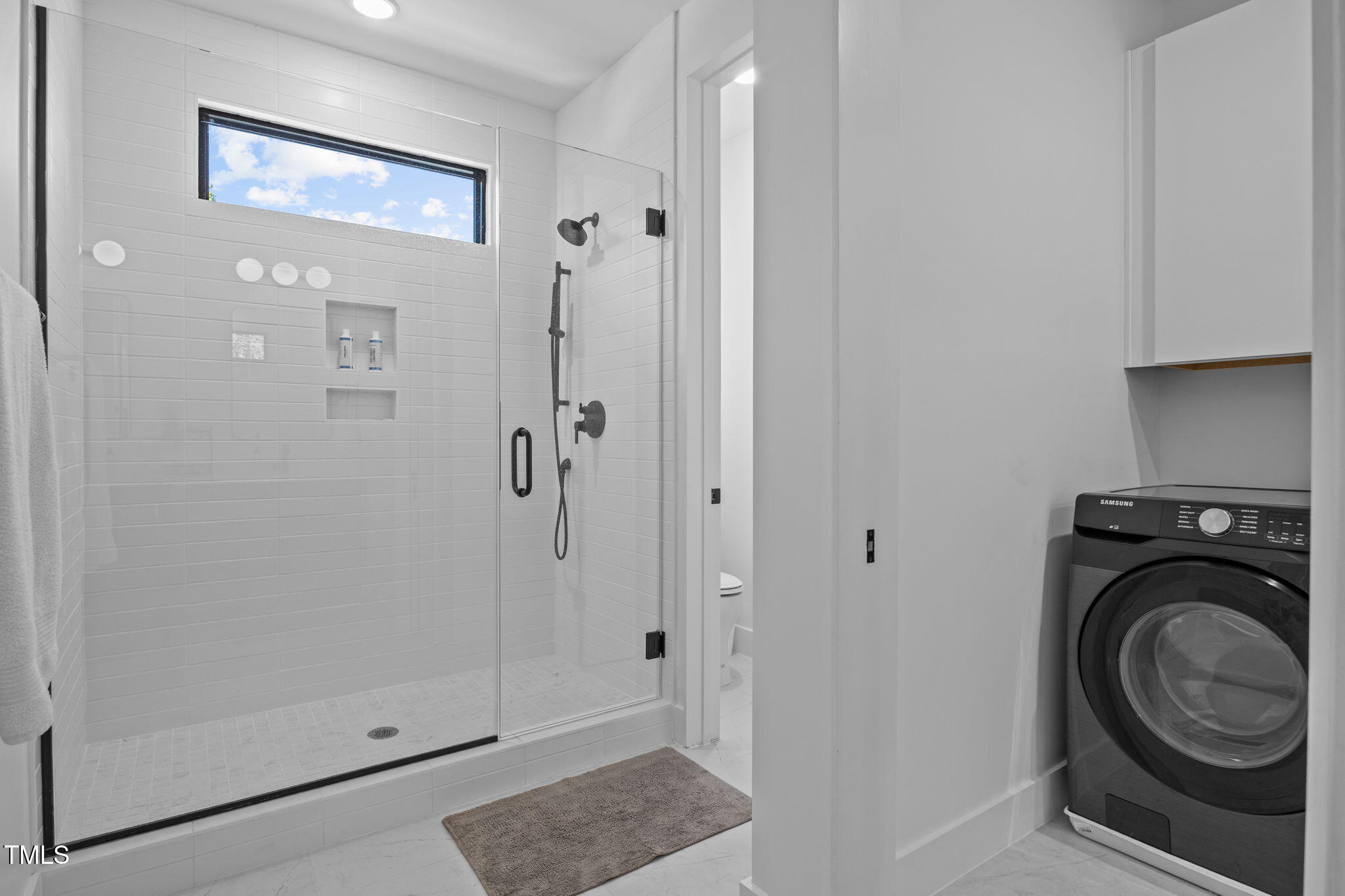 808 Culpepper Lane Raleigh, NC 27610 - Photo 19 of 27 a view of a bathroom with washing machine