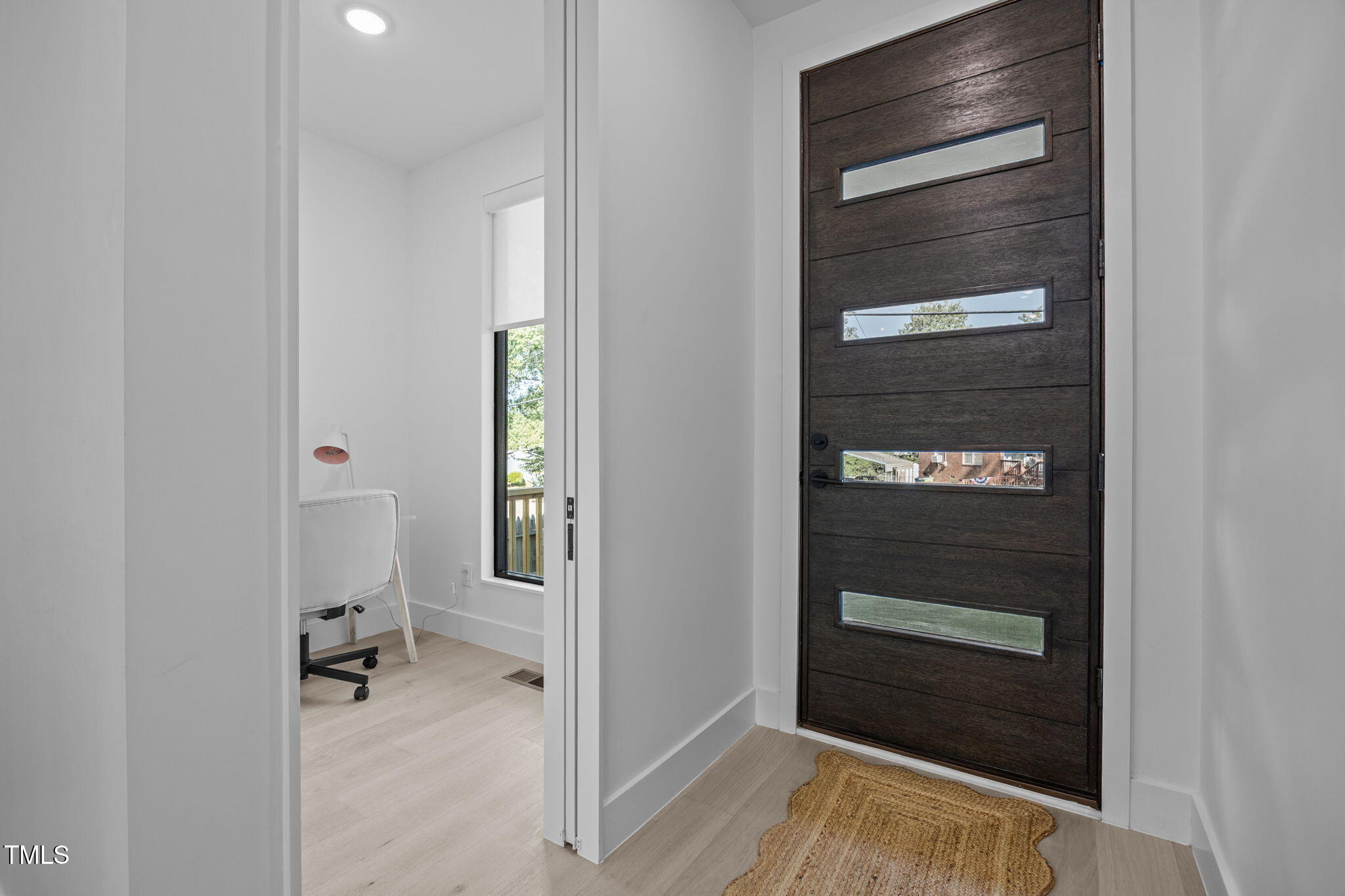 808 Culpepper Lane Raleigh, NC 27610 - Photo 4 of 27 a view of an entryway with wooden floor