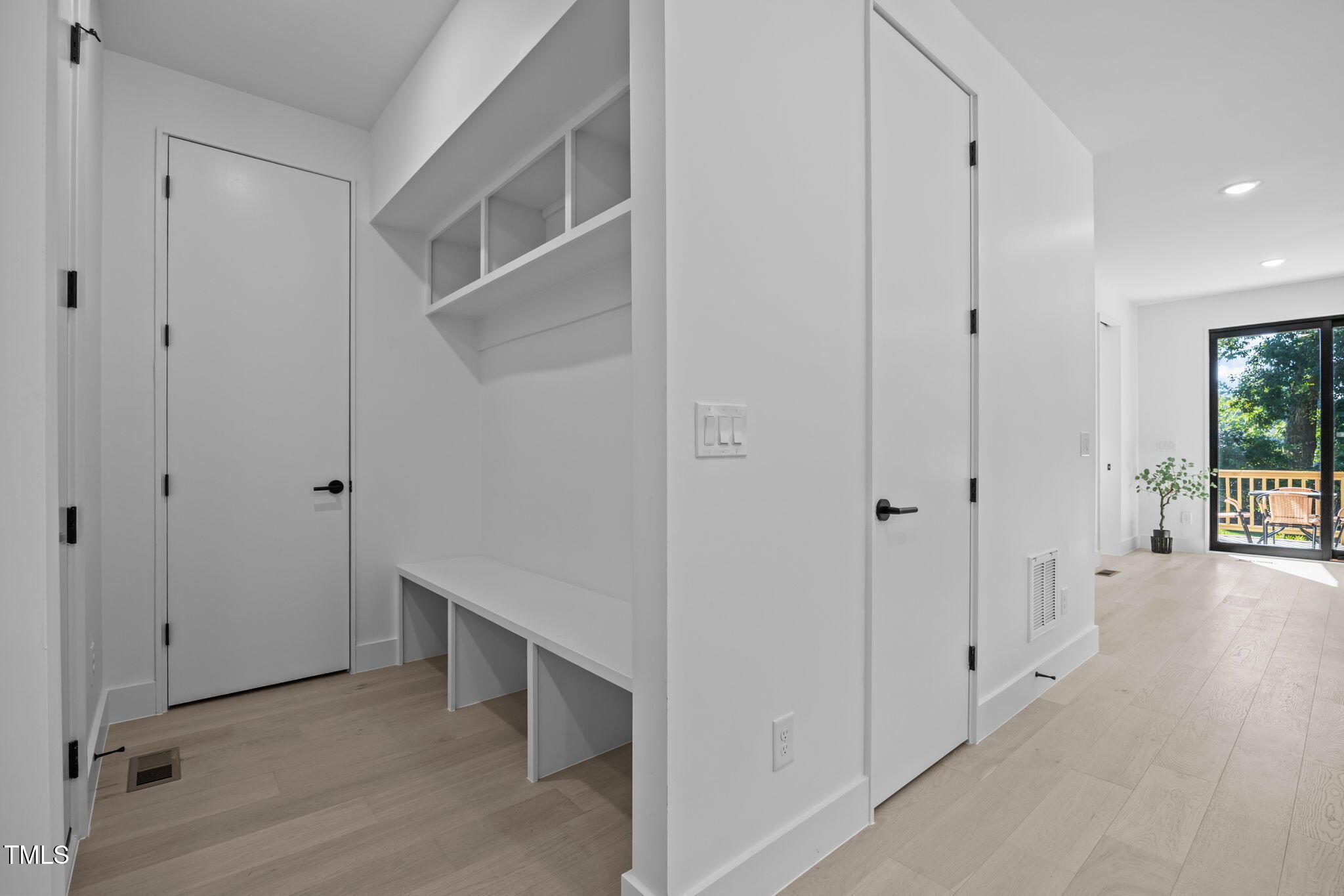 808 Culpepper Lane Raleigh, NC 27610 - Photo 10 of 27 a view of an empty room with wooden floor and a bathroom