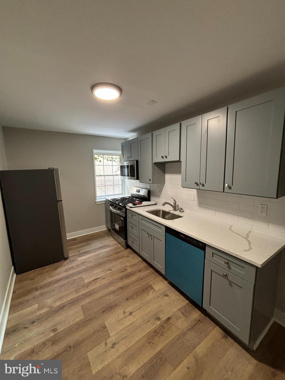 18 West 5th Street, Unit A/B Media, PA 19063 - Photo 1 of 12 a kitchen with stainless steel appliances granite countertop a sink stove and refrigerator