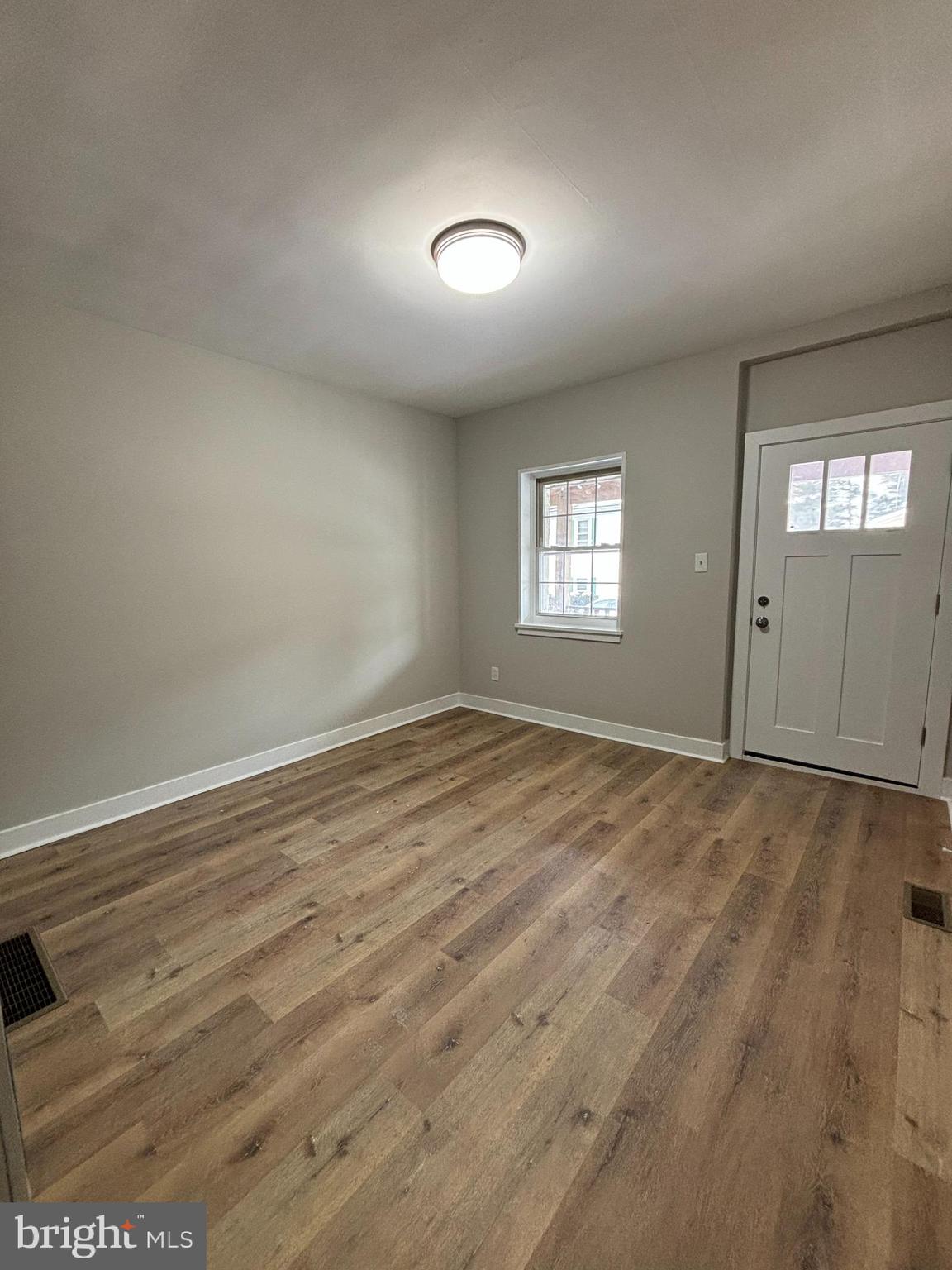 18 West 5th Street, Unit A/B Media, PA 19063 - Photo 7 of 12 an empty room with wooden floor and windows