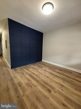 a large kitchen with cabinets and stainless steel appliances