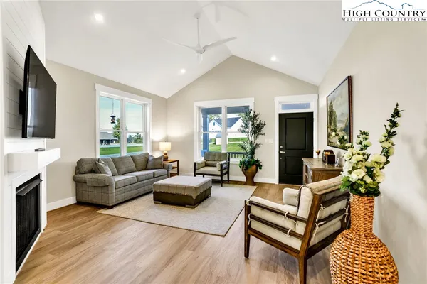 a living room with furniture and a flat screen tv