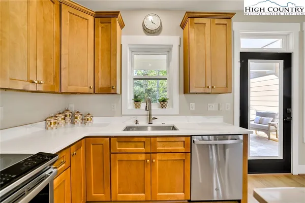 a kitchen with a sink and a refrigerator