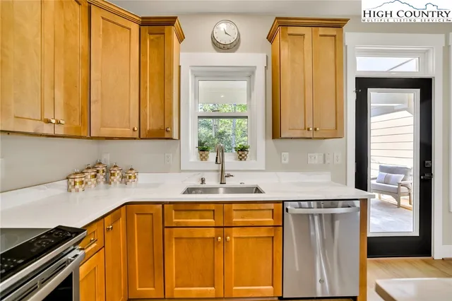 a kitchen with a sink and a refrigerator