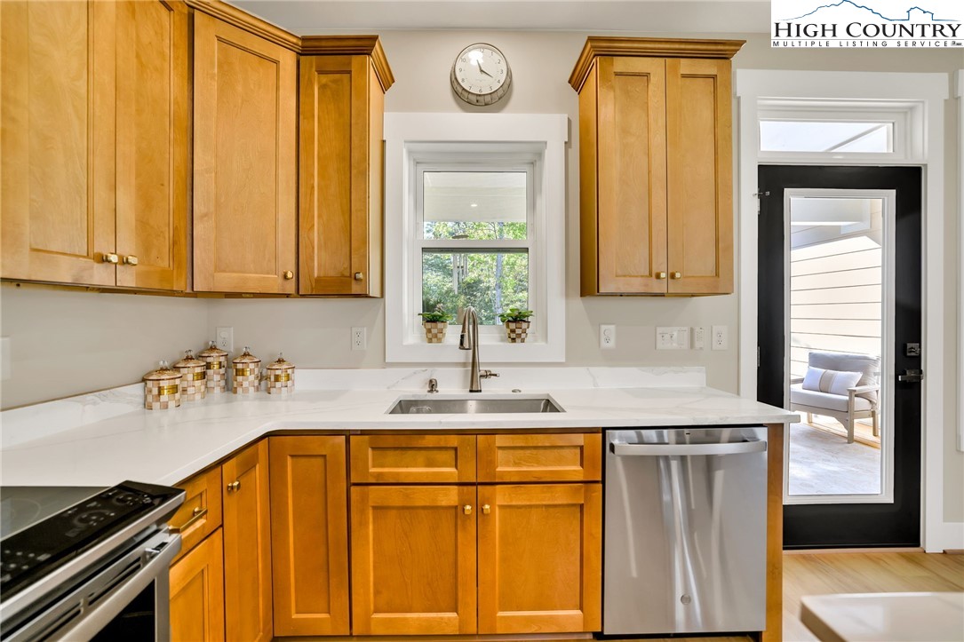 379 Turtle Rdg Road Sparta, NC 28675 - Photo 16 of 43 a kitchen with a sink and a refrigerator