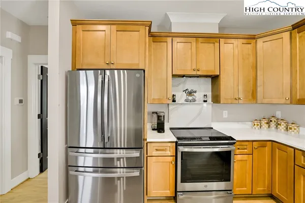 a kitchen with a refrigerator and a sink