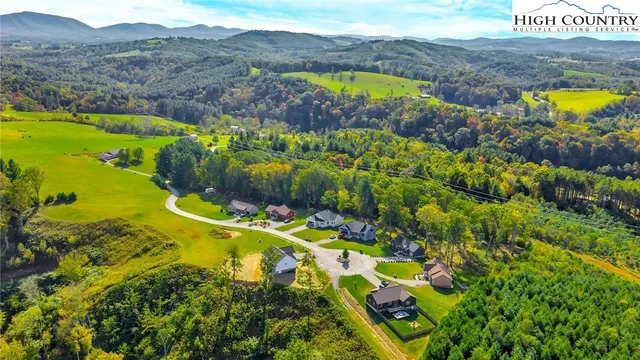 a view of a lake with a yard