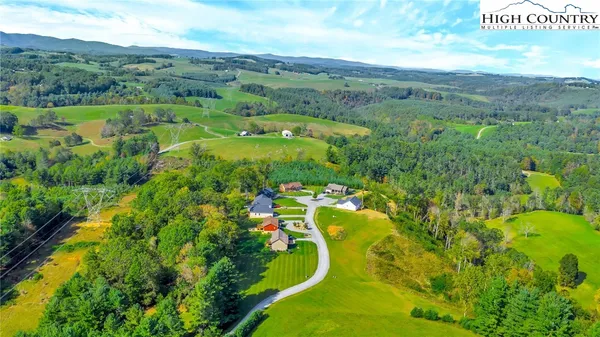 a view of a city with lush green forest