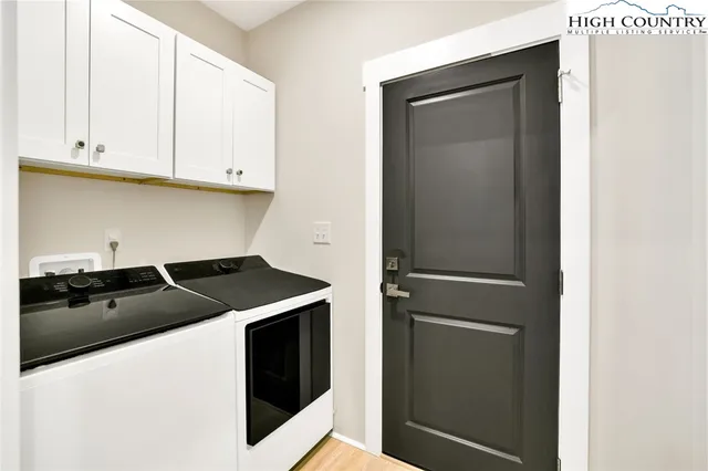 a kitchen with stainless steel appliances granite countertop a refrigerator and a stove