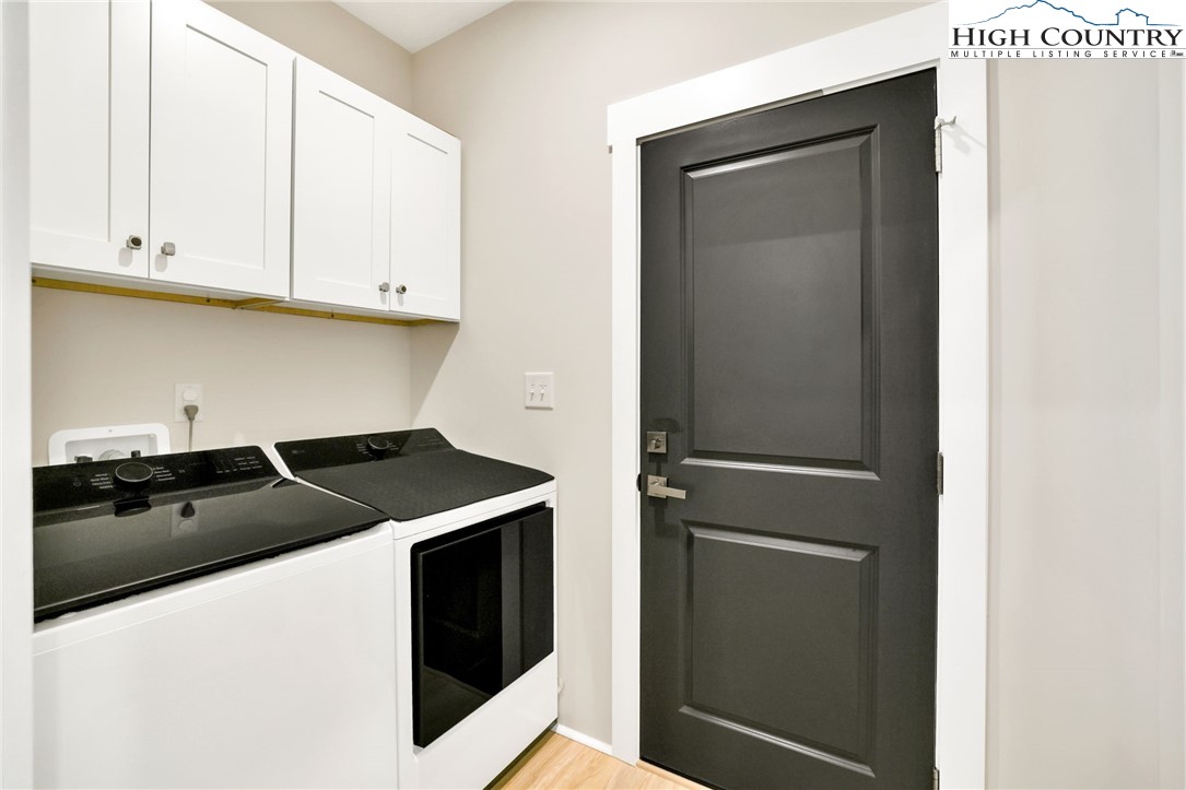 379 Turtle Rdg Road Sparta, NC 28675 - Photo 29 of 43 a kitchen with a sink and a refrigerator