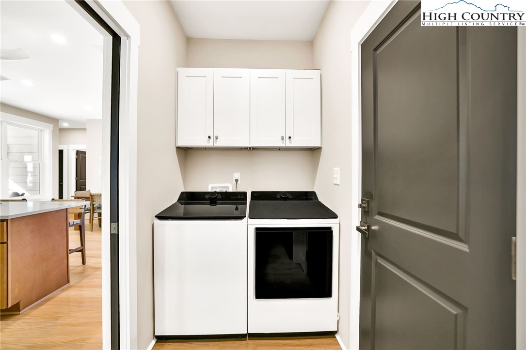 379 Turtle Rdg Road Sparta, NC 28675 - Photo 31 of 43 a kitchen with a stove and white cabinets