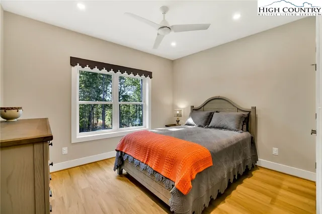 a bathroom with a sink a tub and a mirror