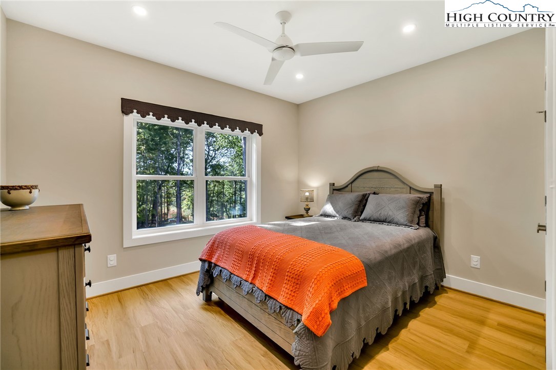 379 Turtle Rdg Road Sparta, NC 28675 - Photo 33 of 43 a bedroom with a bed and a window