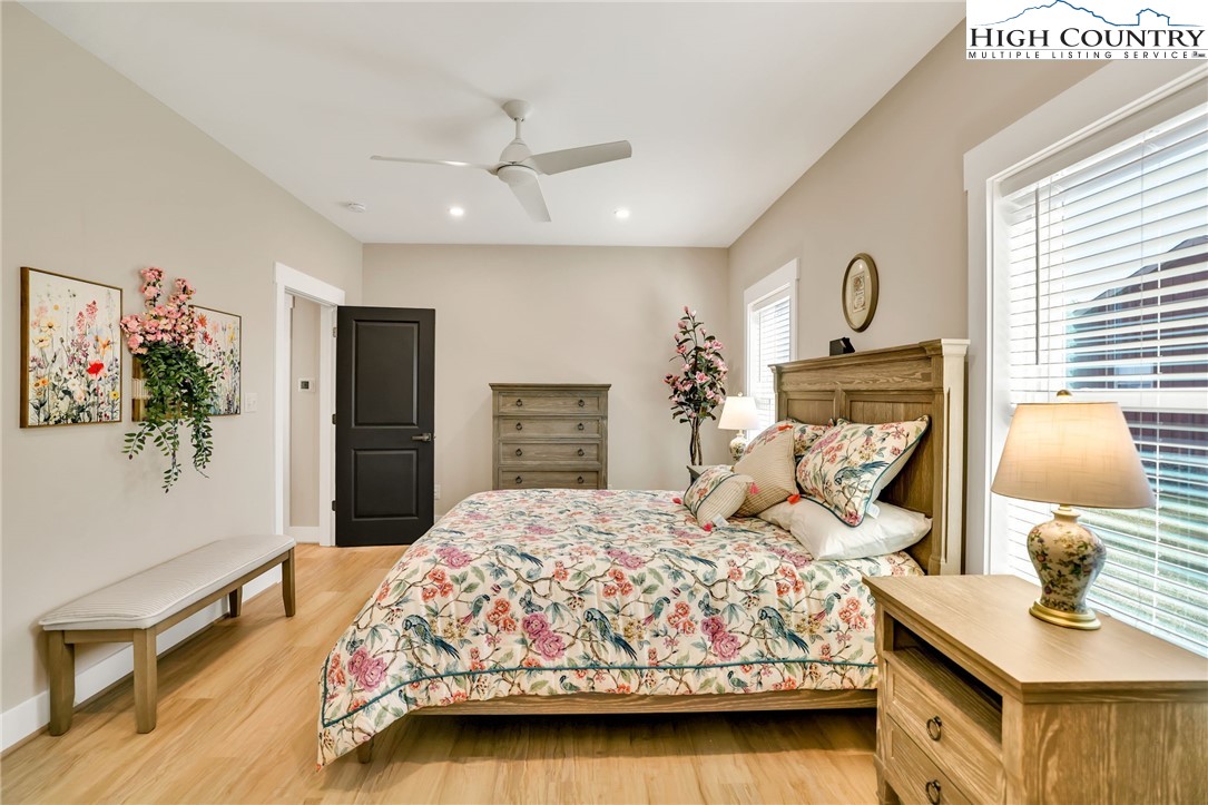 379 Turtle Rdg Road Sparta, NC 28675 - Photo 36 of 43 a bedroom with a bed and wooden floor