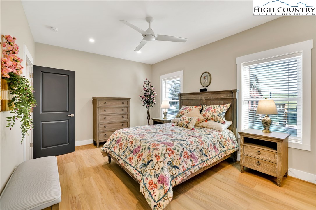 379 Turtle Rdg Road Sparta, NC 28675 - Photo 37 of 43 a bedroom with a bed a dresser and a window