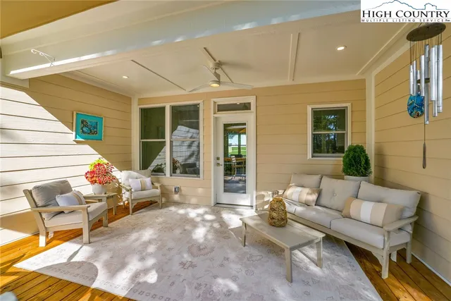 a outdoor space with patio the couches and potted plants with the view of the back
