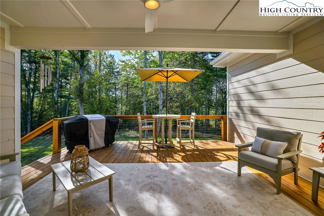 379 Turtle Rdg Road Sparta, NC 28675 - Photo 6 of 43 a view of a patio with a table chairs and a backyard