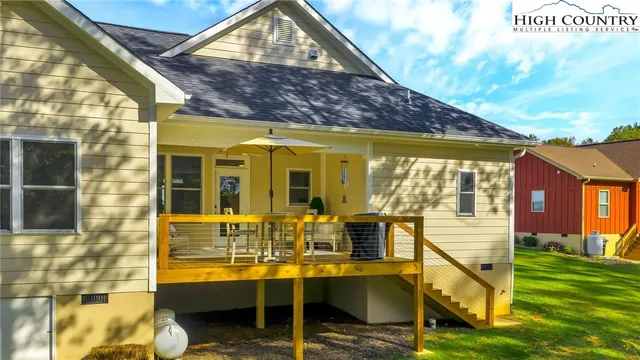 a view of house with a swimming pool