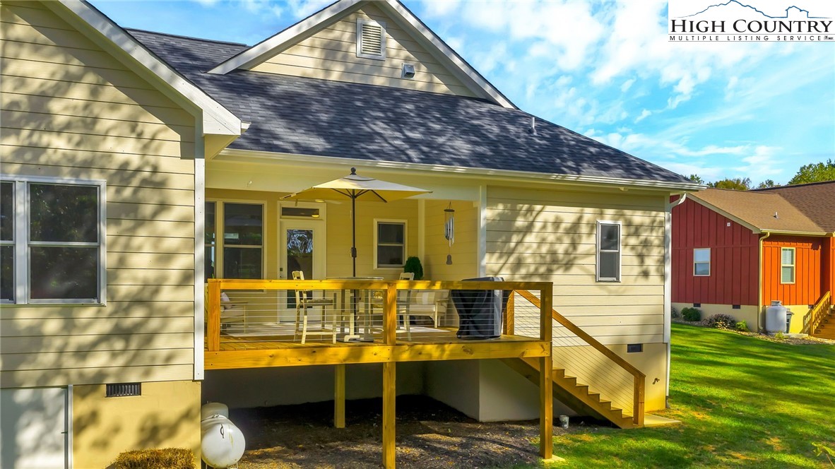 379 Turtle Rdg Road Sparta, NC 28675 - Photo 7 of 43 a view of house with a swimming pool