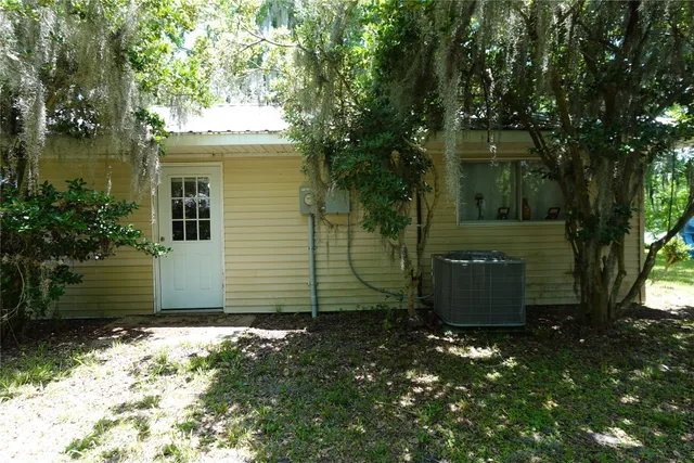 a view of a backyard of the house