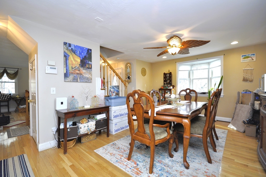 413 Harvard Street Whitman, MA 02382 - Photo 11 of 42 a view of a a dining room with furniture window and wooden floor